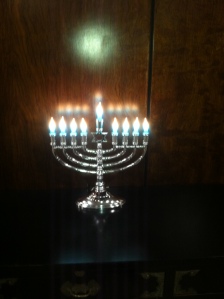 Menorah with all the candles lit - marking the 8th night of Hanukkah (taken in my building, not at the party)